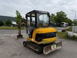 2001 Caterpillar 302.5 mini excavator, rear three-quarter view