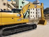 2026 Caterpillar 323D3 crawler excavator, side view