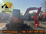 2024 Kubota KX057-4 mini excavator side view