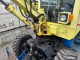 1992 Komatsu PC30 wheel excavator cab and boom detail