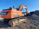 2021 Doosan DX225LC-5 crawler excavator, rear three-quarter view