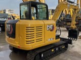 2023 Caterpillar 305.5E2 mini excavator, rear three-quarter view