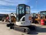 2011 Bobcat 425 mini excavator, front three-quarter view
