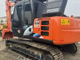 2023 Hitachi ZX120 crawler excavator, rear three-quarter view