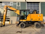 2020 Caterpillar MH3022-06C material handler, side view