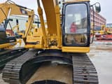 2014 Caterpillar 320BL crawler excavator, front view of cab and boom
