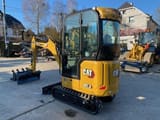 2023 Caterpillar 301.8 mini excavator, rear three-quarter view