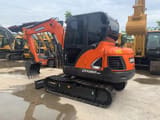 2022 Doosan DX60-9C crawler excavator, three-quarter view