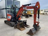 2021 Kubota U50-5 mini excavator, side view with attachments