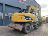 2014 Caterpillar M315D wheel excavator, rear three-quarter view