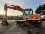 2004 Fiat-Kobelco E145W wheel excavator side view
