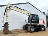 2011 Caterpillar M316D wheel excavator side view