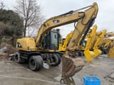 2018 Caterpillar M312D2 wheel excavator, side view