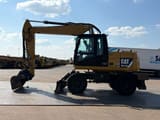 2012 Caterpillar M313D wheel excavator, side profile view