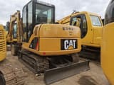 Caterpillar 306 mini excavator, rear three-quarter view
