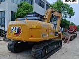 2022 Caterpillar 315D2 LGC crawler excavator, rear three-quarter view