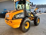 2011 JCB 409 wheel loader, rear three-quarter view