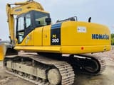 2014 Komatsu PC300 crawler excavator, rear three-quarter view