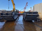 2025 Caterpillar 320 Amphibious Excavator front view of undercarriage