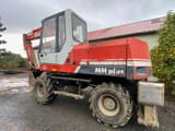 1995 O&K MH 4PLUS wheel excavator, side view