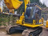 2024 Komatsu PC130 crawler excavator, front three-quarter view
