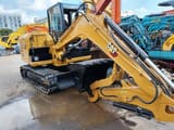 2025 Caterpillar 305.5 mini excavator, side view