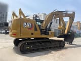 2024 Caterpillar 323 crawler excavator, rear three-quarter view