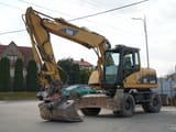 2003 Caterpillar M313C wheel excavator, side profile view