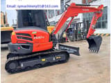 2023 Kubota KX057-4 mini excavator, side view