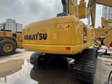 2025 Komatsu PC220-7 crawler excavator, rear three-quarter view