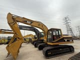 2022 Caterpillar 320BL crawler excavator, side view