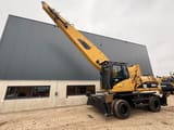 2008 Caterpillar M325D material handler, side view