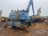 2011 Fuchs MHL335 material handler, rear three-quarter view