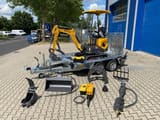 Berger Kraus BK1000JSR mini excavator on trailer with attachments