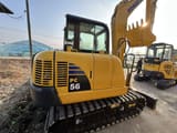 2024 Komatsu PC56 mini excavator, rear three-quarter view