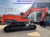 2024 Doosan DX225LCA crawler excavator, side profile view