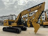 2024 Caterpillar 320 crawler excavator, side view