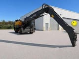 2021 Volvo EW240EMH material handler, rear three-quarter view