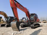 2024 Doosan DX225LCA crawler excavator, front three-quarter view