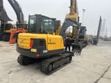 2023 Volvo EC60C mini excavator, rear three-quarter view
