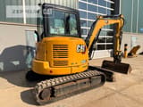 2021 Caterpillar 304E2 mini excavator, rear three-quarter view