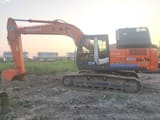 Hitachi ZAXIS 210 crawler excavator, side view
