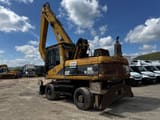 2005 Caterpillar M322C MH material handler, rear three-quarter view