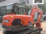 2023 Doosan DX60-9C mini excavator, rear three-quarter view