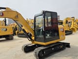 2023 Caterpillar 305.5E mini excavator, three-quarter view