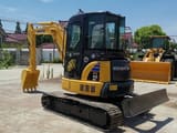 2020 Komatsu PC55MR mini excavator, front three-quarter view