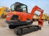 2023 Doosan DX60-9C mini excavator, rear three-quarter view