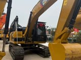 2024 Caterpillar 320D paletli ekskavatör önden görünüm