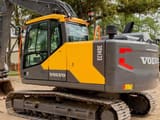 Volvo EC140E crawler excavator, rear three-quarter view