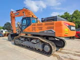 2023 Doosan DX530LC-7M crawler excavator, rear three-quarter view